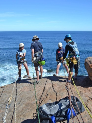 Dad and daughter abseiling